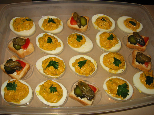 Savoury eggs and smoked oysters on mini toast