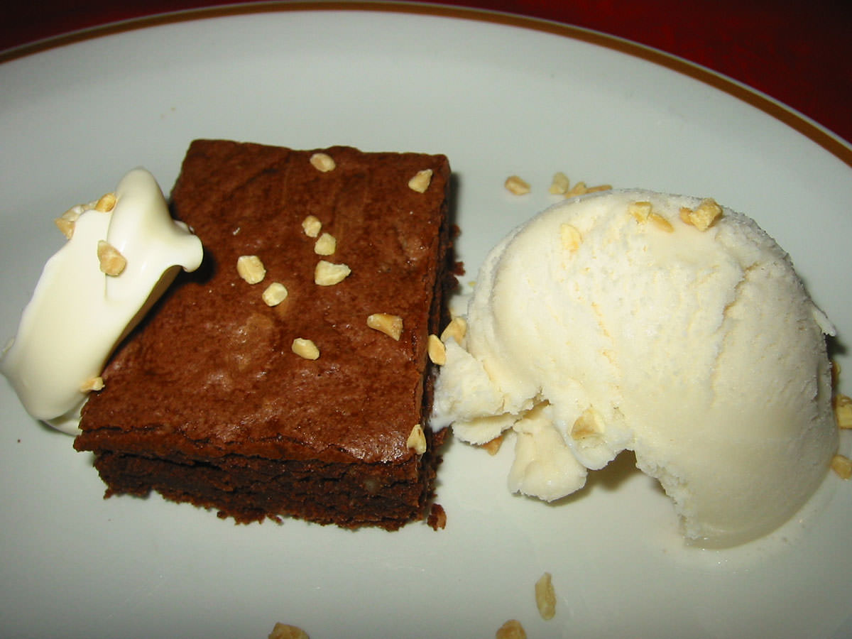 Chocolate brownie with double cream and ice cream