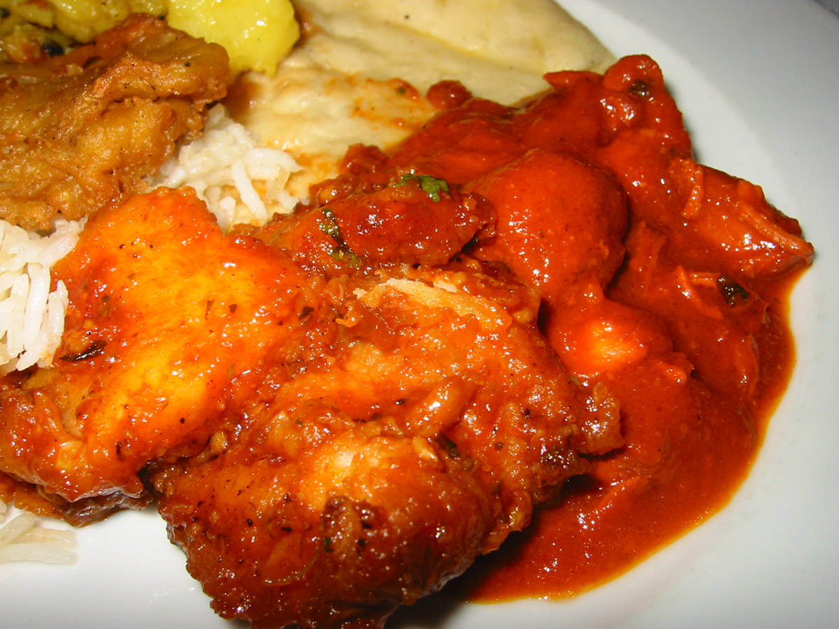 Close-up of garlic fish and butter chicken