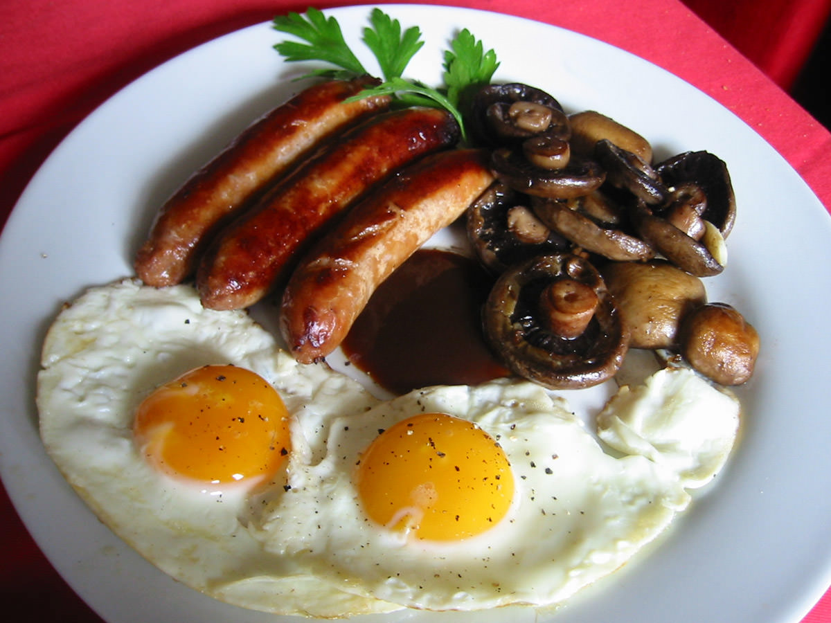 Sausages, garlic mushrooms, two fried eggs and a plop of smokey barbecue sauce