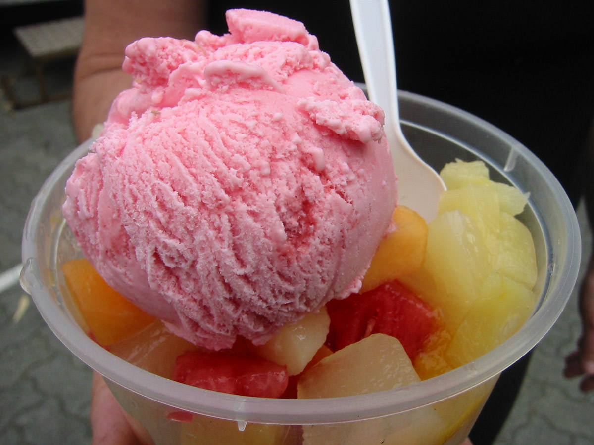 Strawberry ice cream with fruit salad