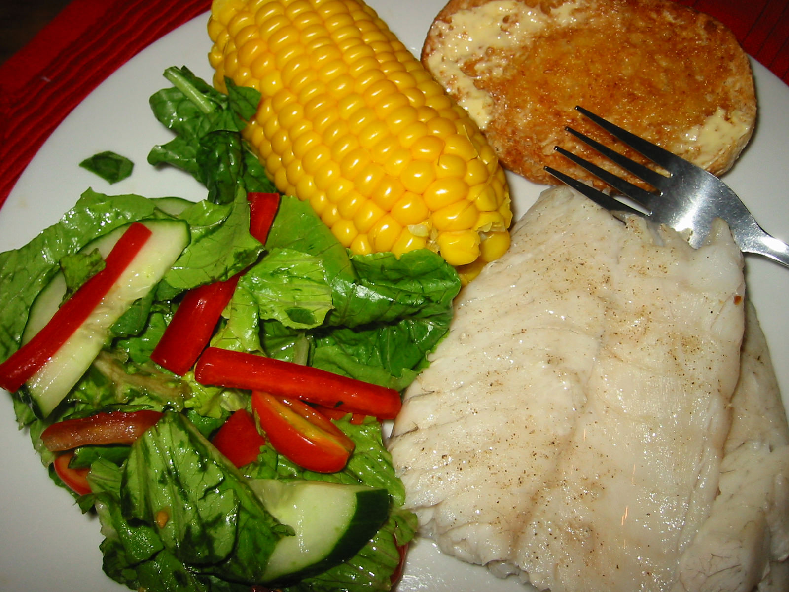 Fish, salad, corn, bread