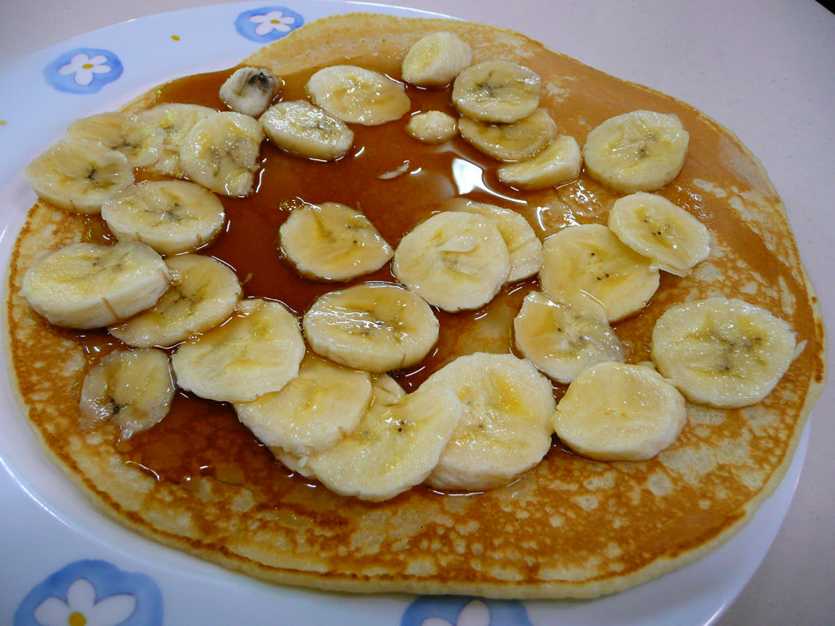 Pancake with banana and maple syrup