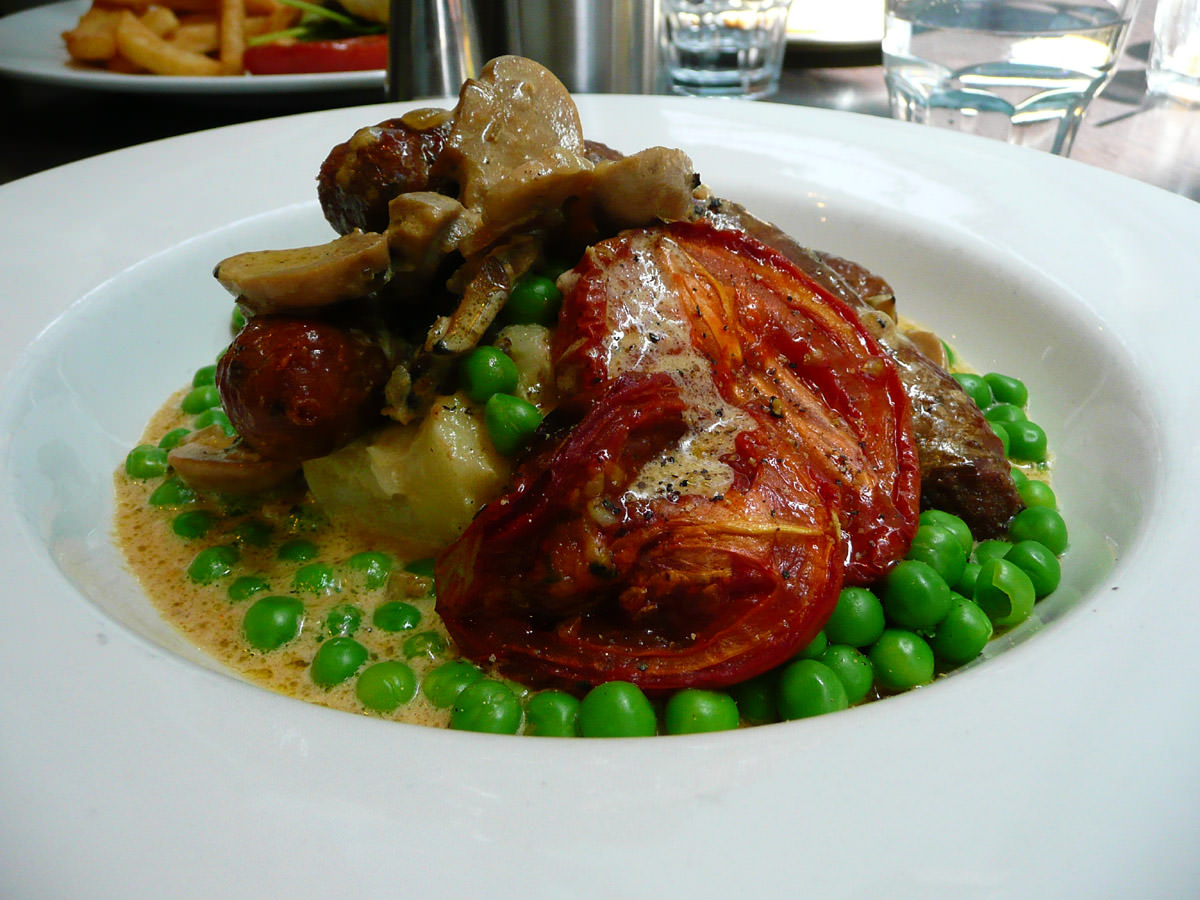Pork sausages with mash and green peas