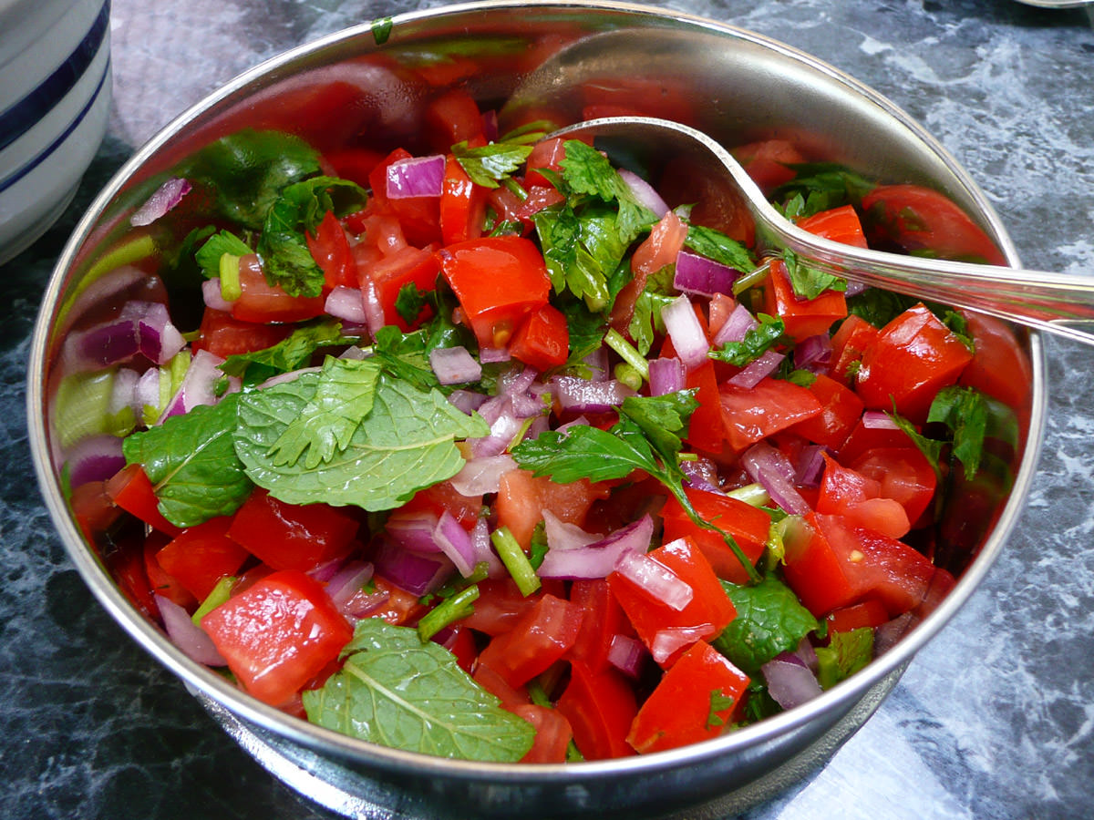 Tomato, mint, coriander, parsley and red onions with lemon juice and sugar