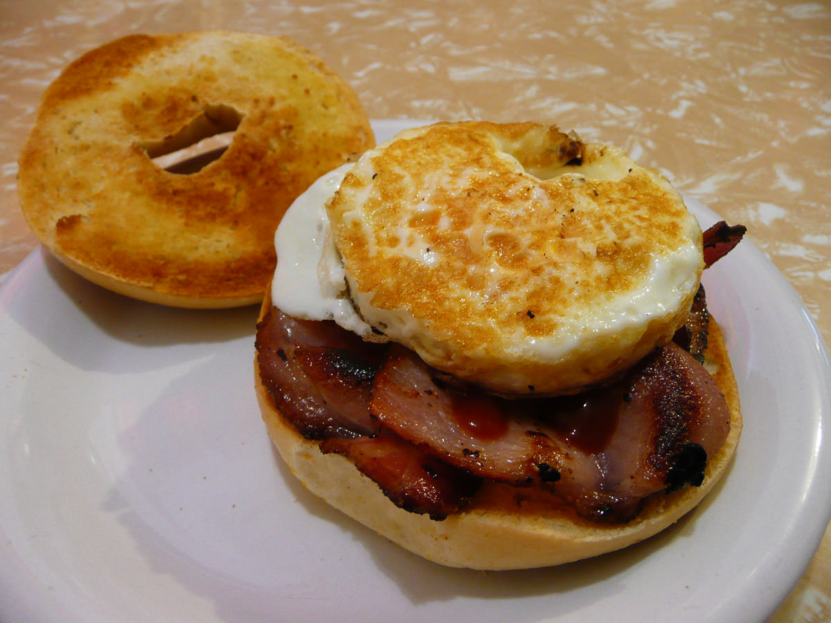 Bacon and egg bagel with tomato sauce