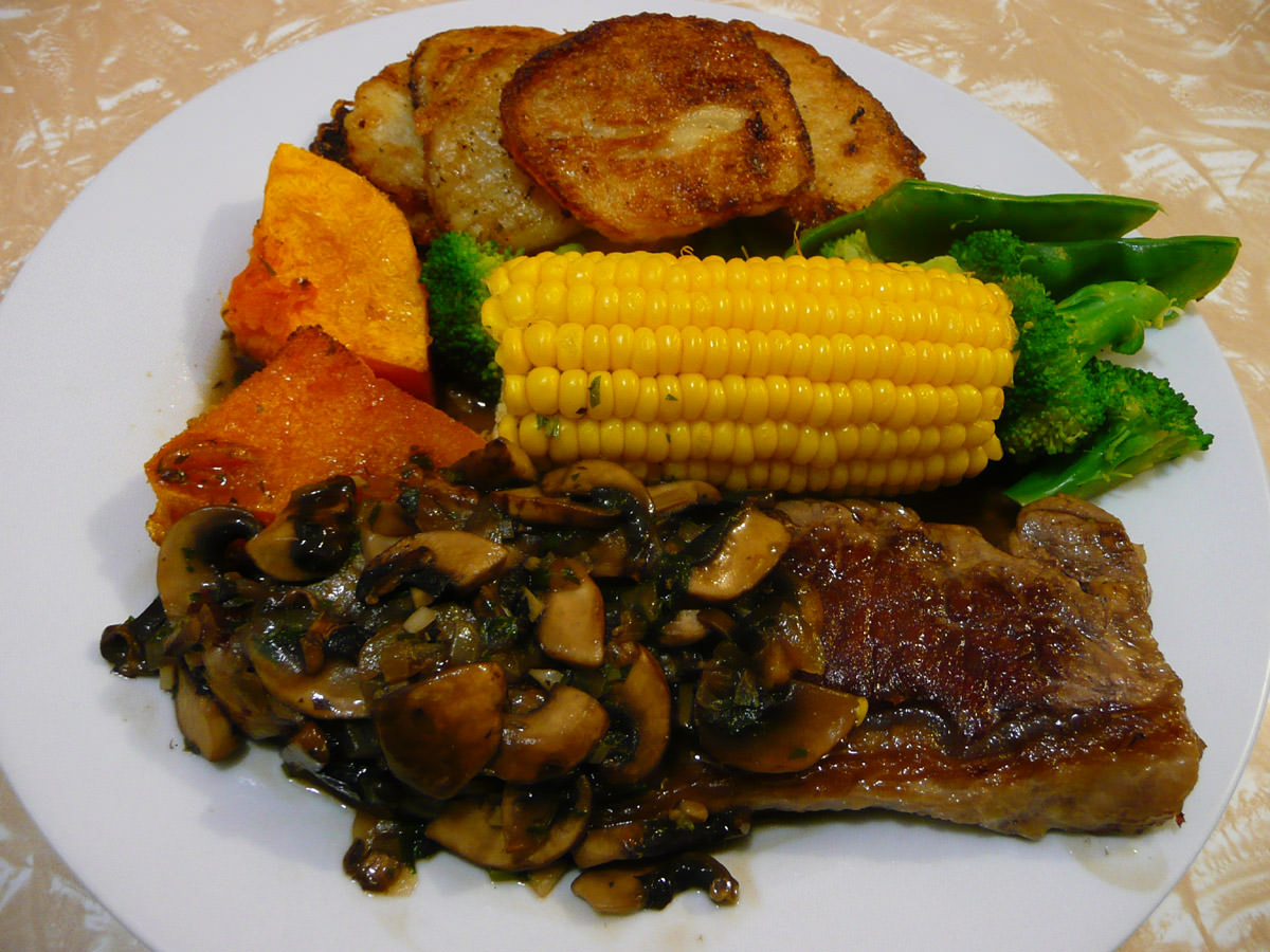 Steak with mushroom sauce and vegetables