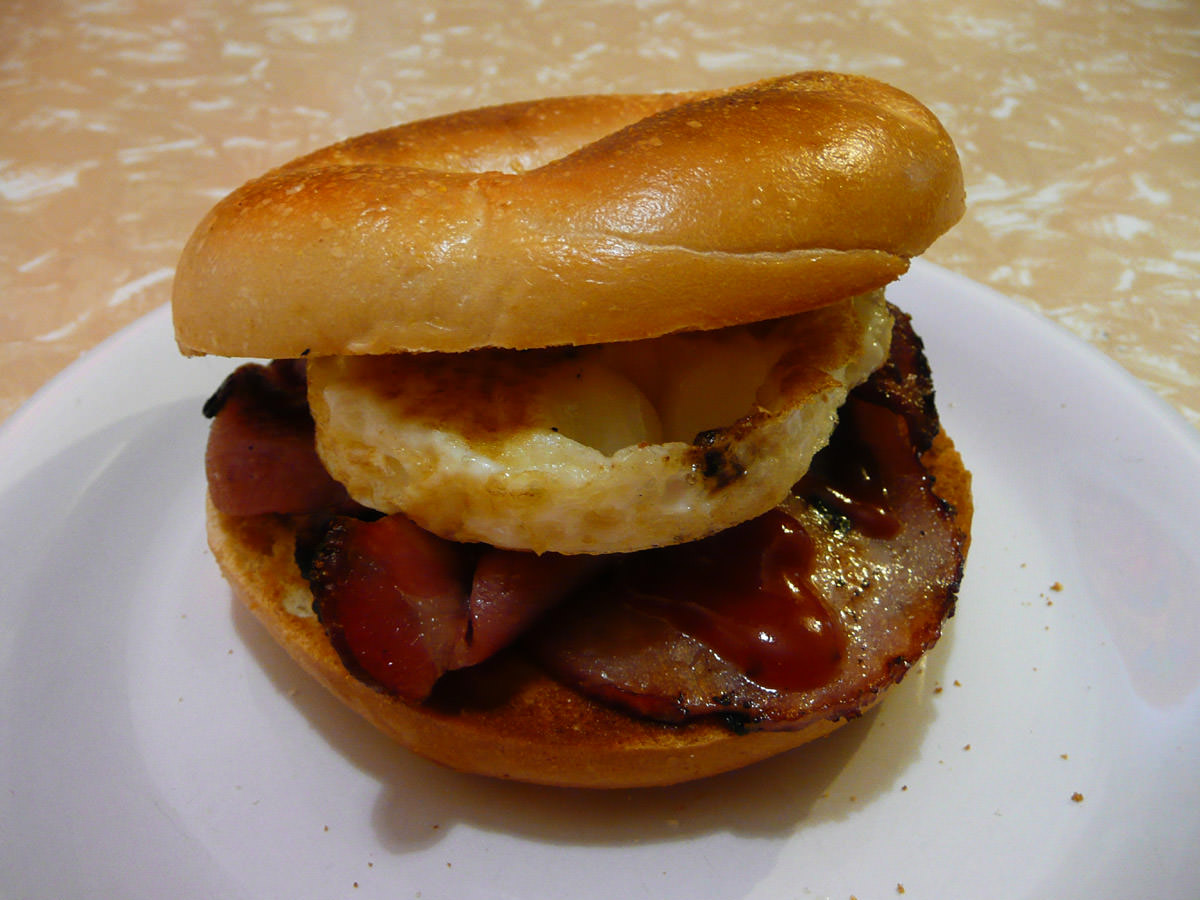 Bacon and egg bagel with tomato sauce