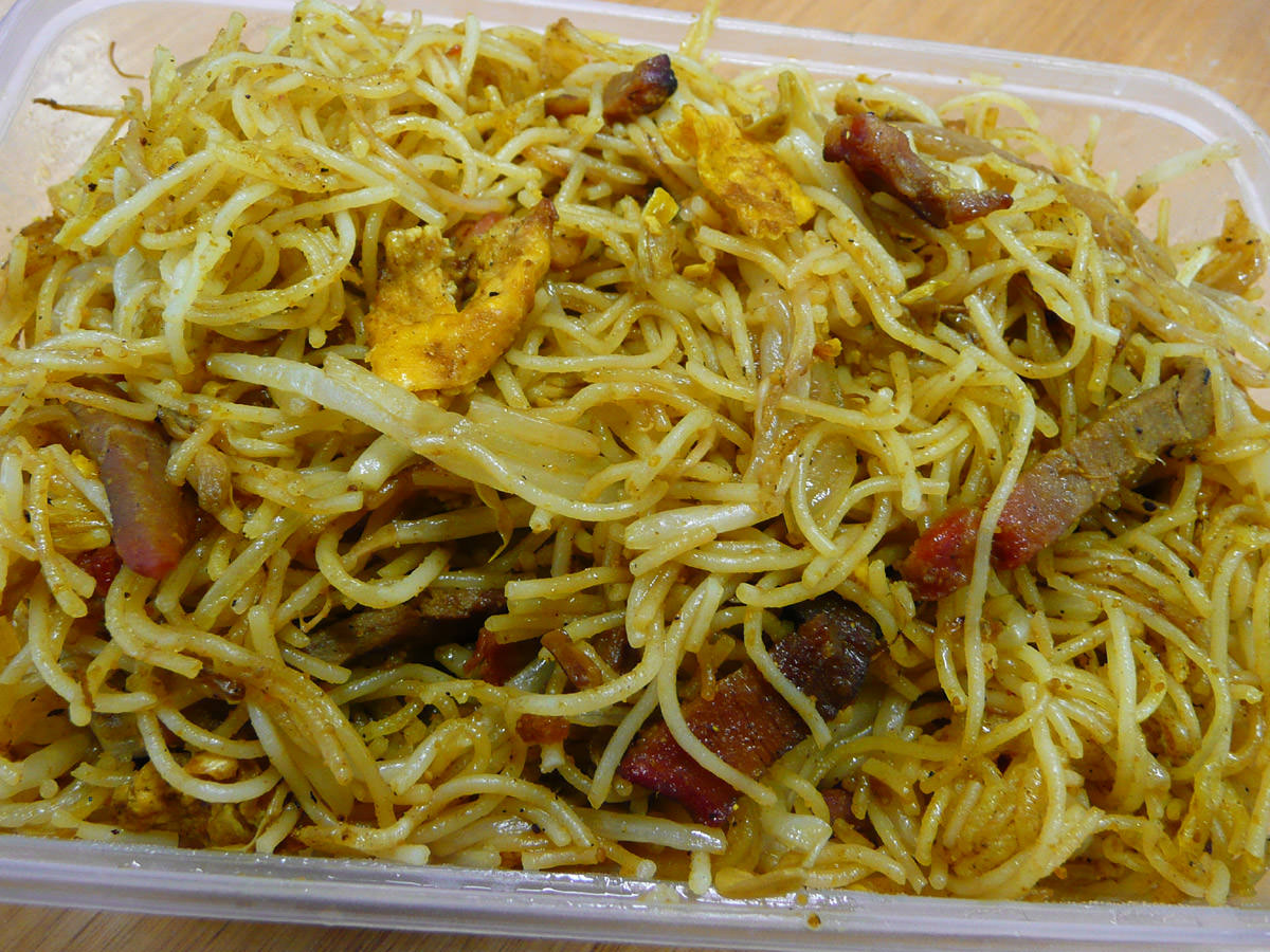 Stir-fried curry noodles with egg and BBQ pork