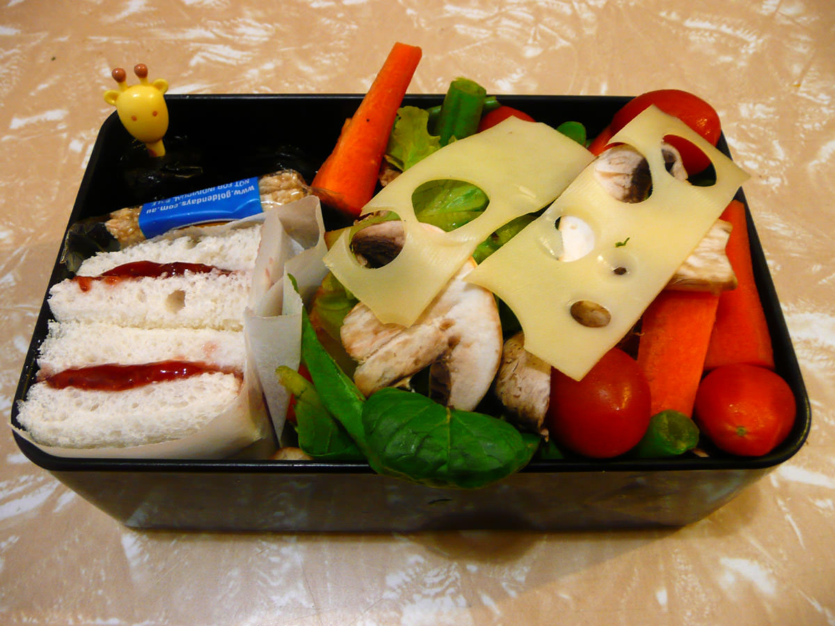 Salad, swiss cheese, pruns and strawberry sandwiches