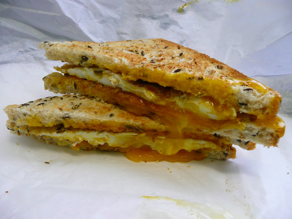 Fried egg toasted sandwich with gooey yolk