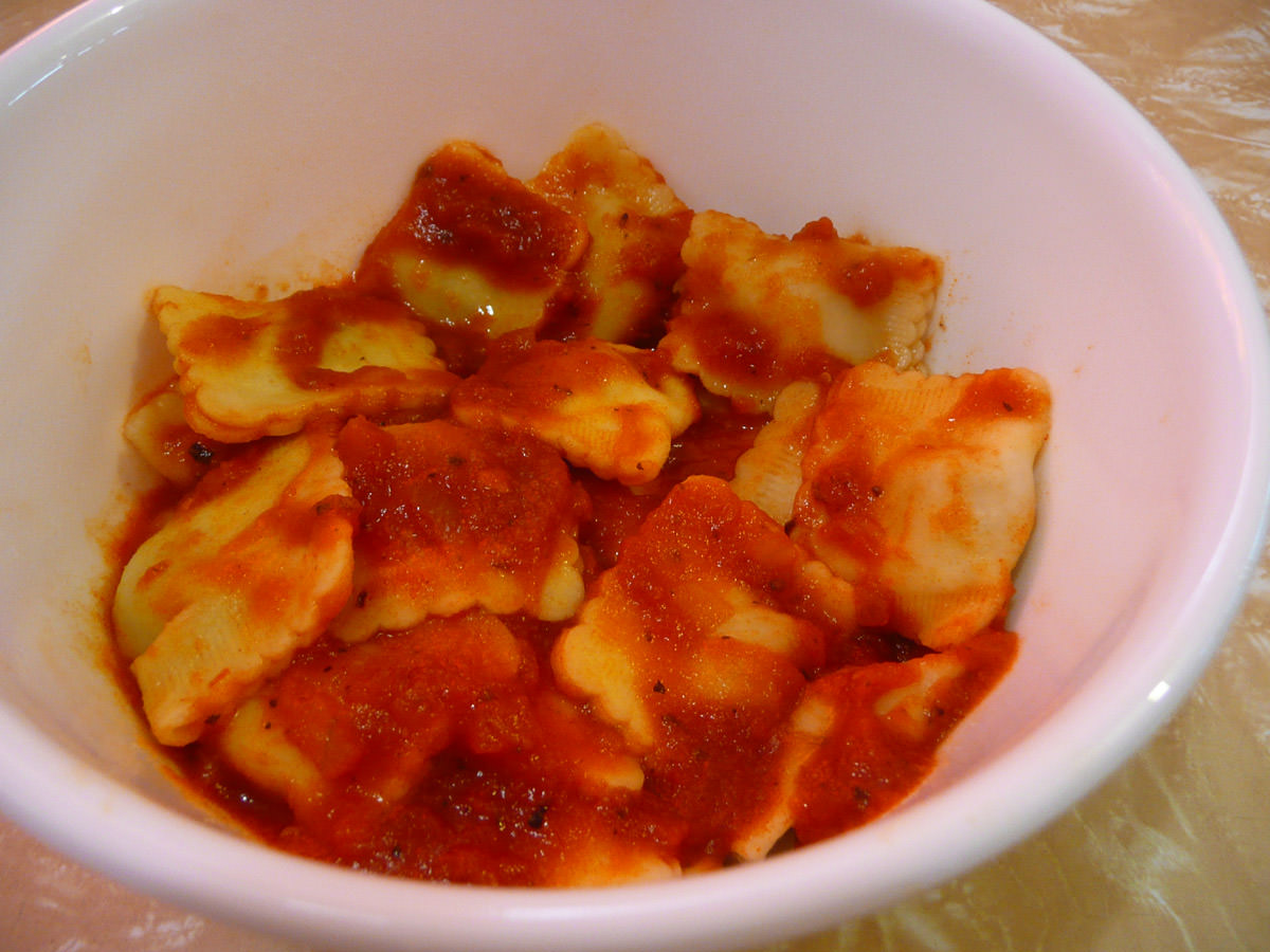 Chicken and mushroom-filled ravioli with stir-through tomato and garlic sauce