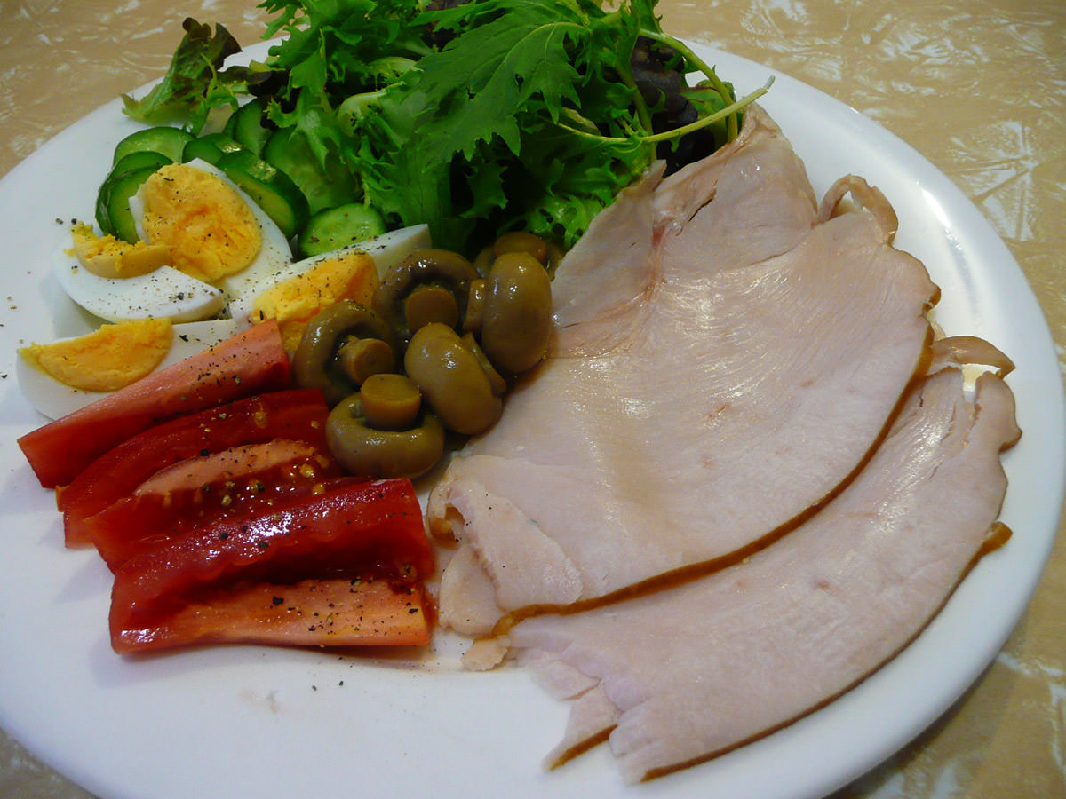 Honey-roasted turkey breast, hard-boiled eggs, salad and marinated mushrooms