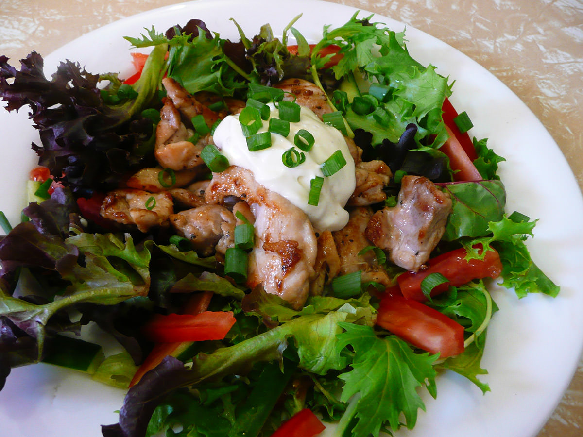 Chicken and salad topped with aioli
