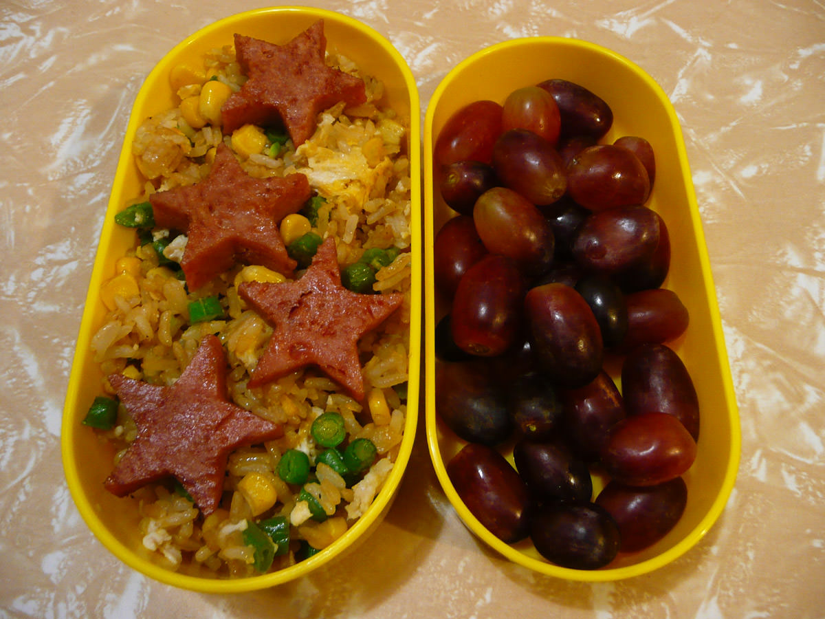 Bento - SPAM stars with fried rice and red grapes