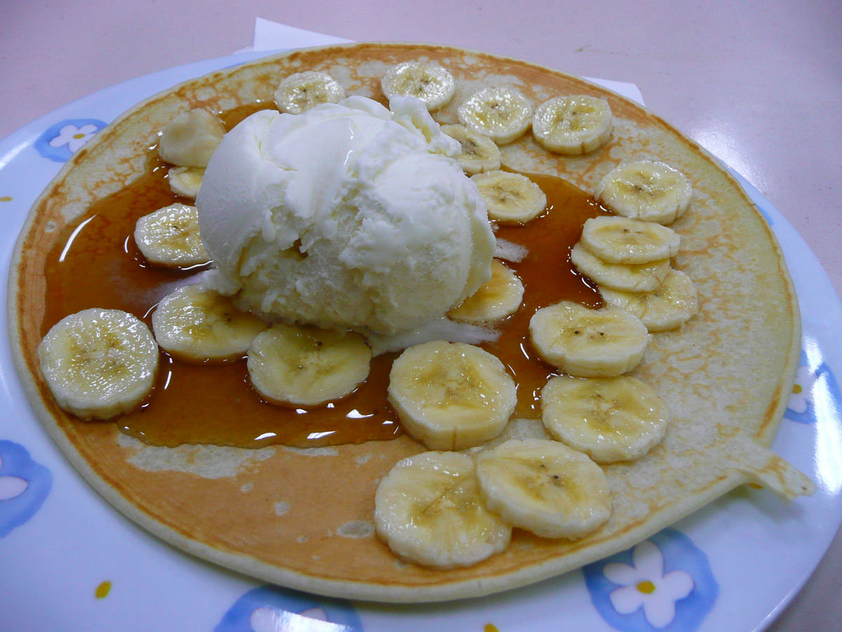 Pancake with ice cream, banana and maple syrup