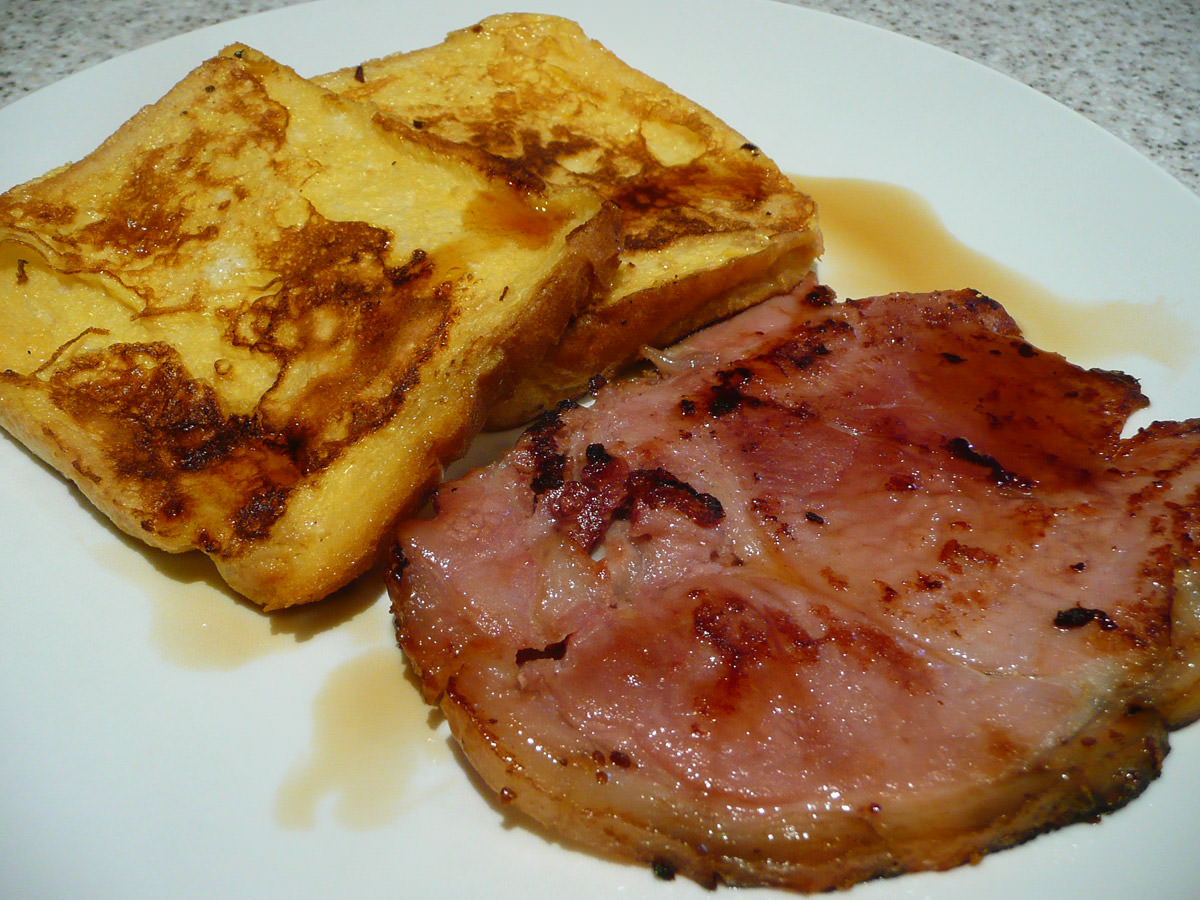 Fried Christmas ham with french toast and maple syrup