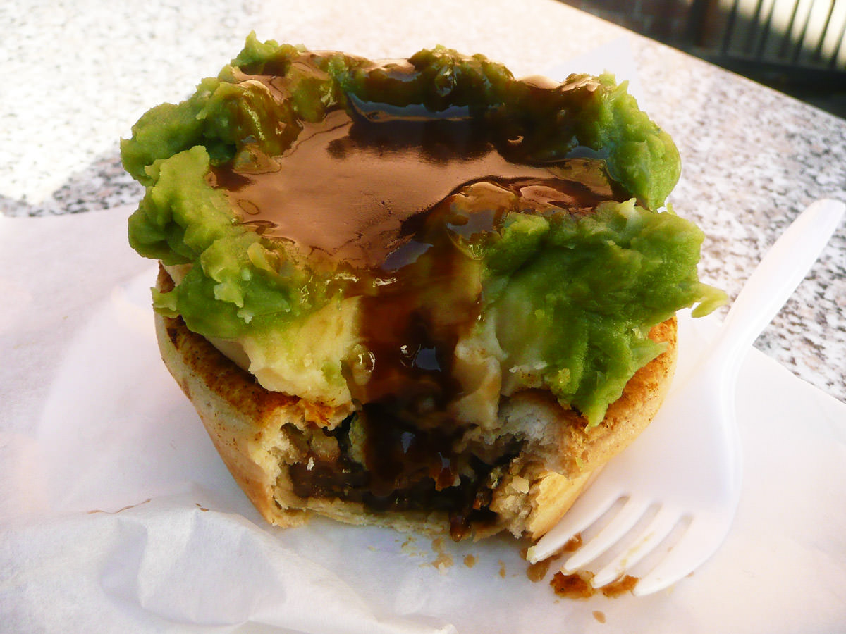 Curry tiger pie, Harry's Cafe De Wheels, Haymarket, Sydney - innards shot with gravy dribbling down
