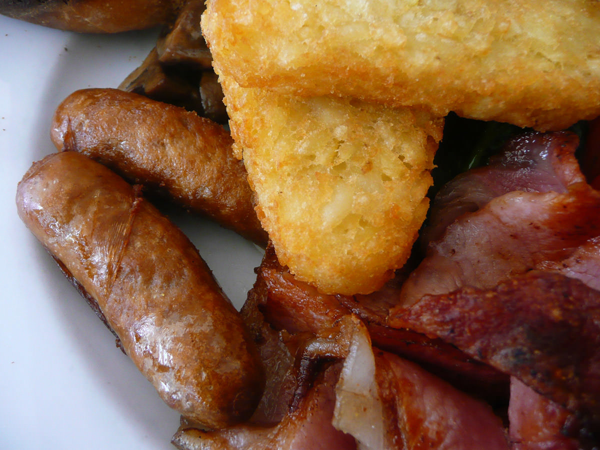 A meeting of fried things - hash browns, bacon and sausage