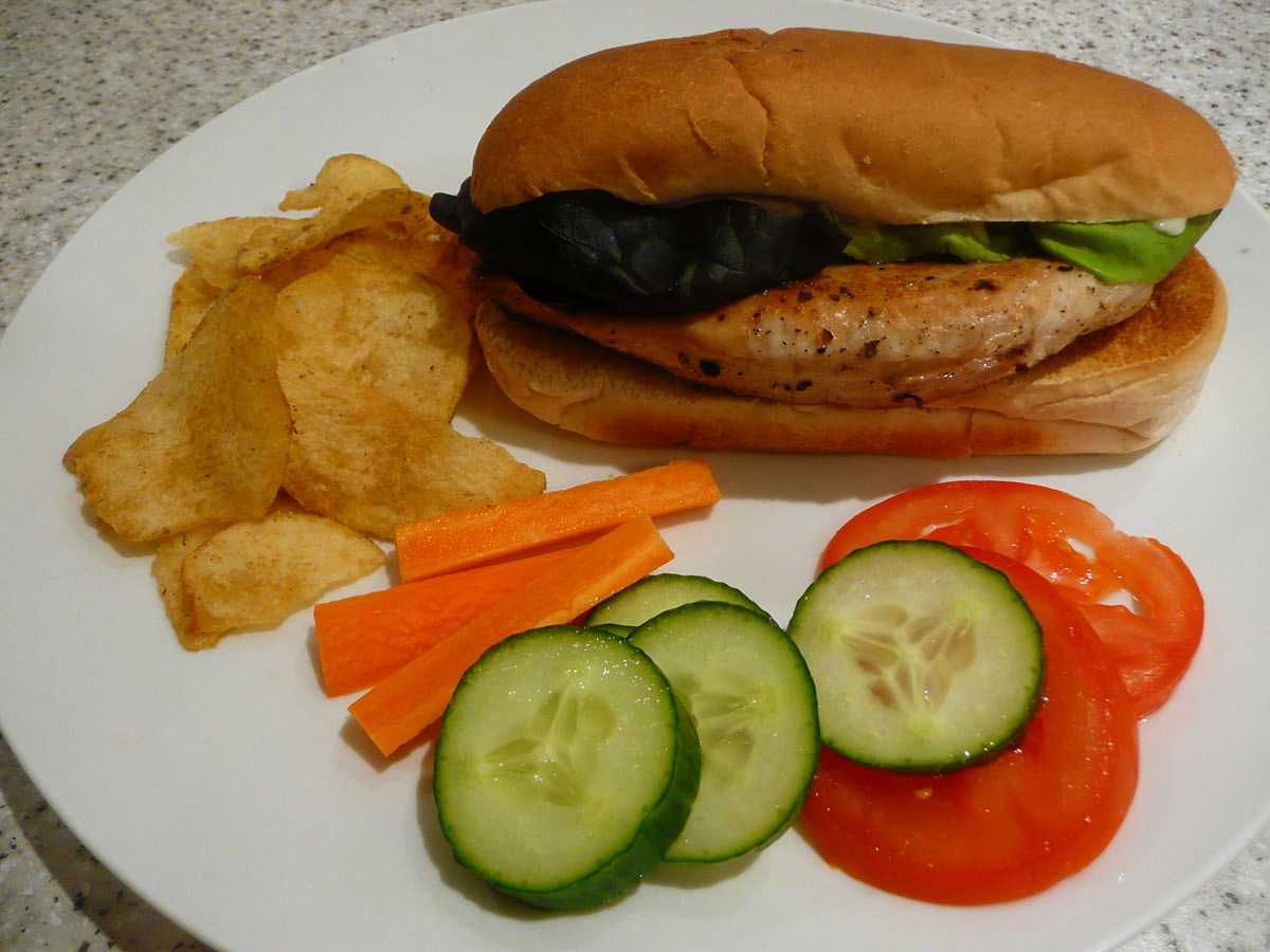 Turkey breast sandwich, salad and chips
