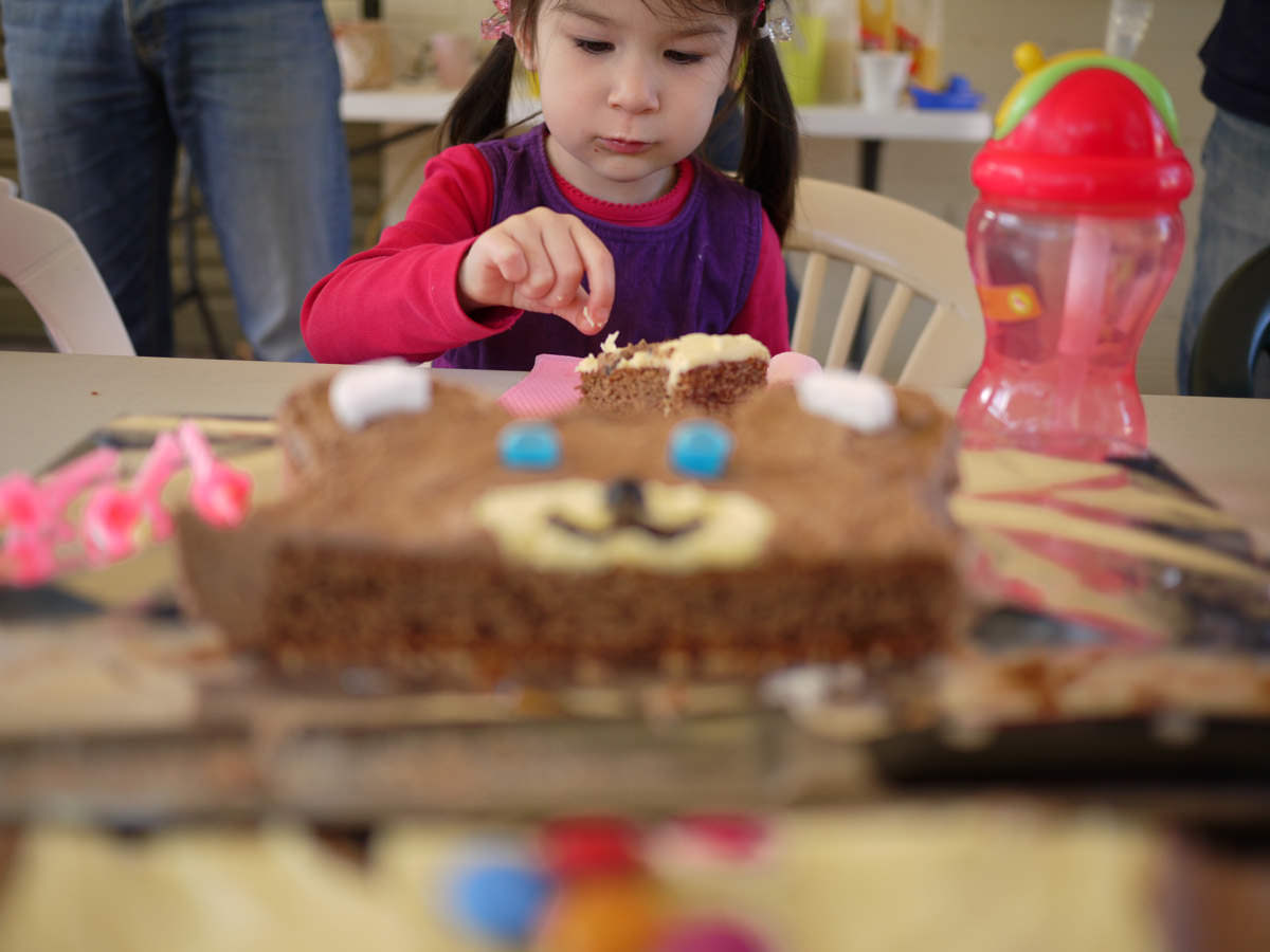 Ruby concentrates on eating her birthday cake