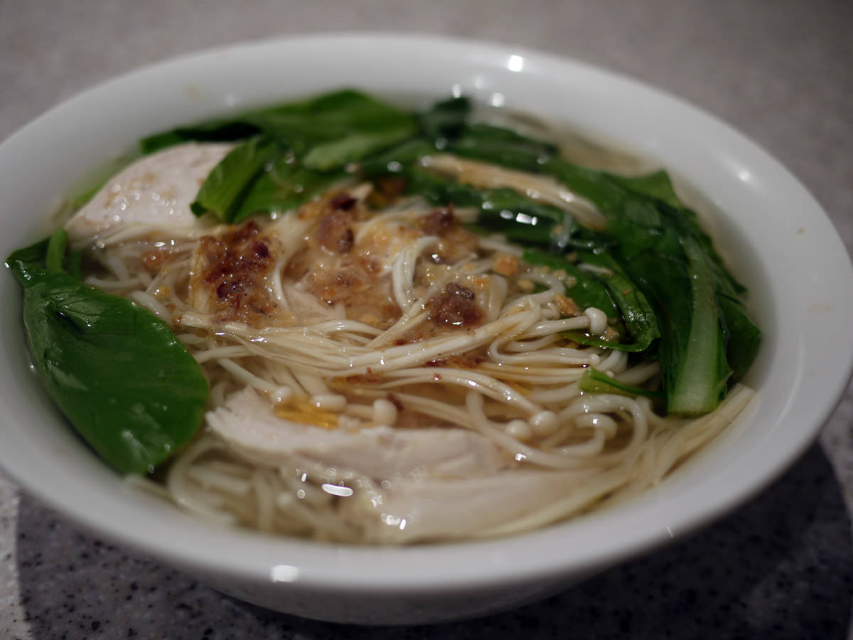 Noodle soup with chicken and enoki mushrooms