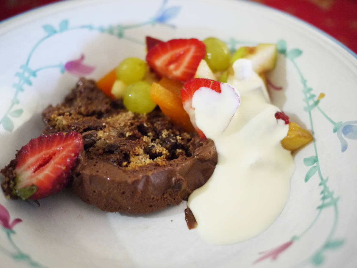 Chocolate mousse log, fruit salad and cream