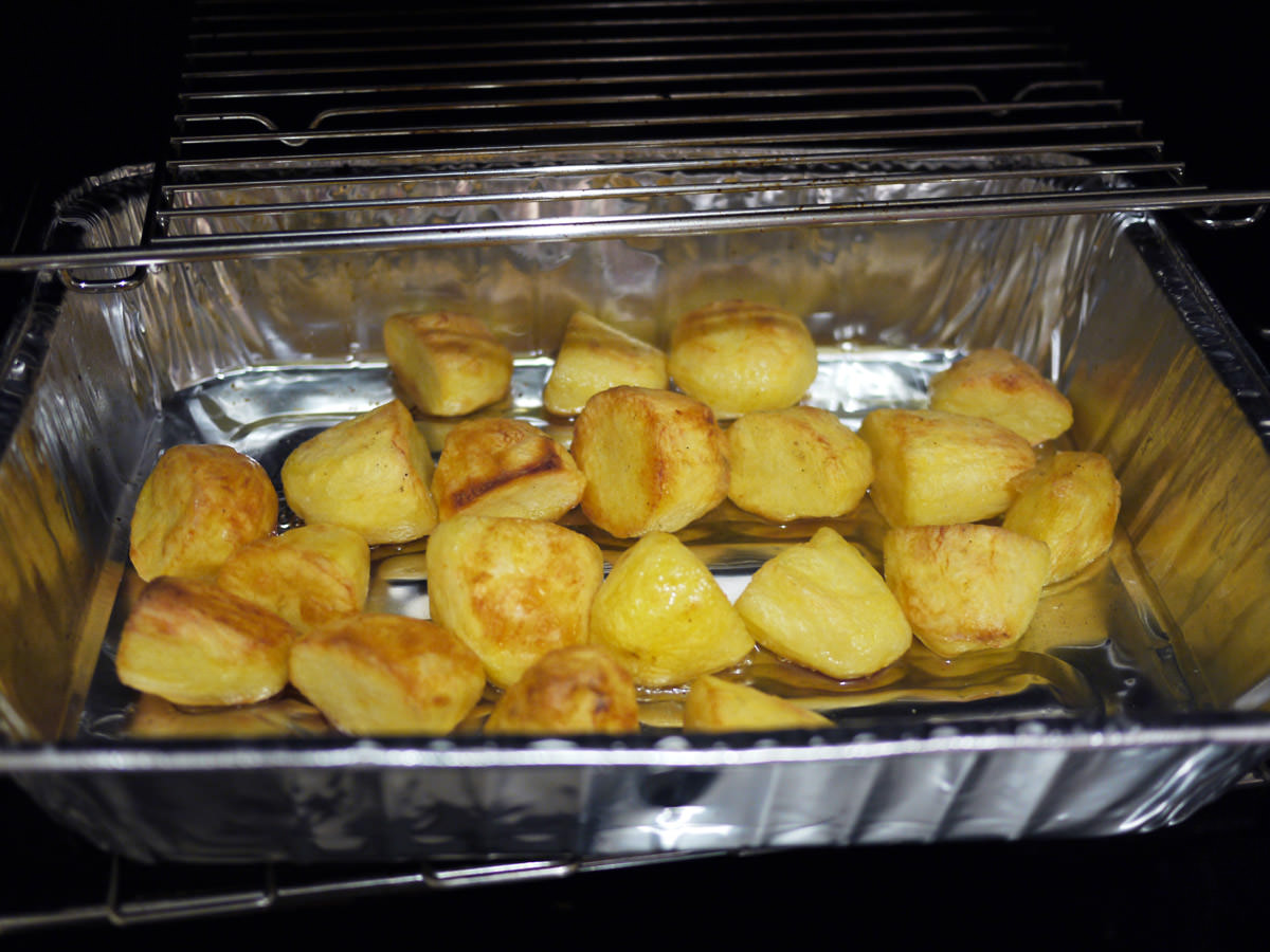 Duck fat roast potatoes in the oven tray - oh, the heat and the aroma
