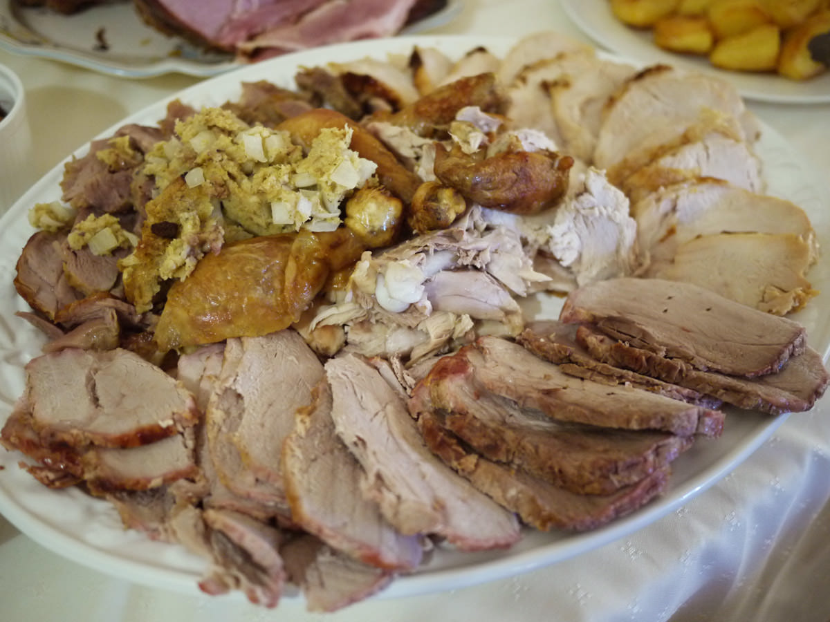 Meat platter: turkey thigh roast, turkey breast roast, roast pork, roast chicken and stuffing