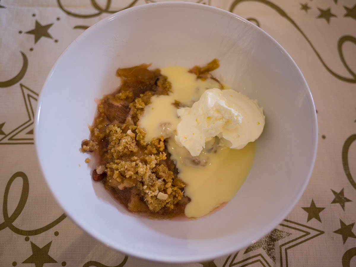My bowl of apple and rhubarb crumble with cream and custard