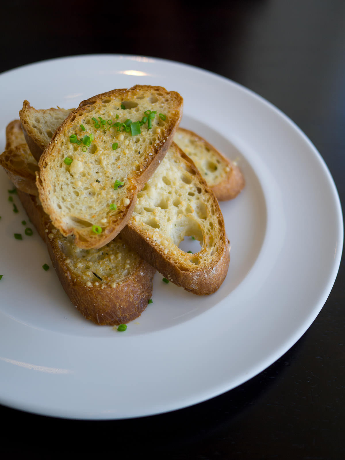Oven-baked garlic, parsley and parmesan bread (AU$7.80)