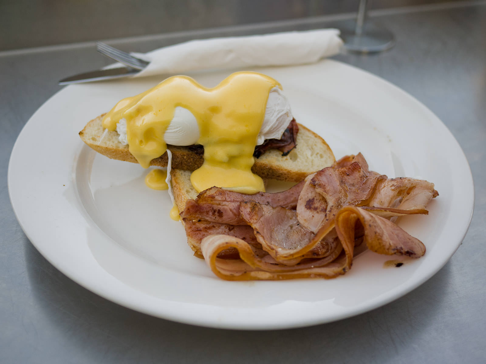 French - poached eggs, Brie, tomato, hollandaise (AU$19), side of bacon (AU$4)
