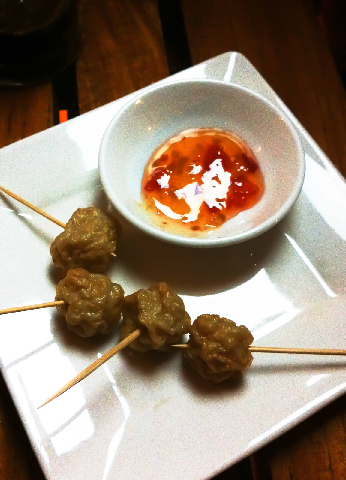 Cocktail hour nibbles - fish balls on skewers with sweet chilli sauce