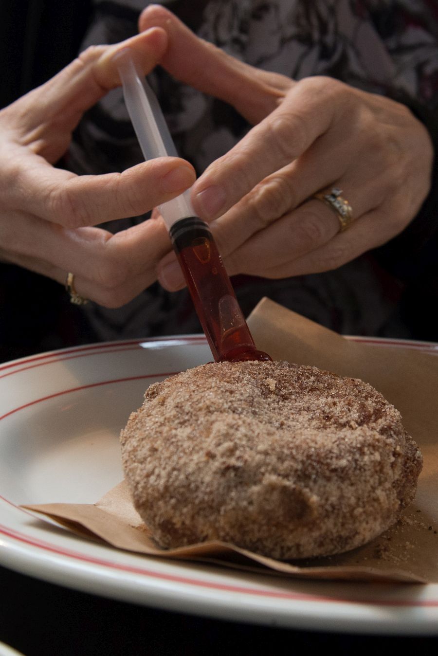 Injecting a Mister D Doughnut (NZ$6) with jelly