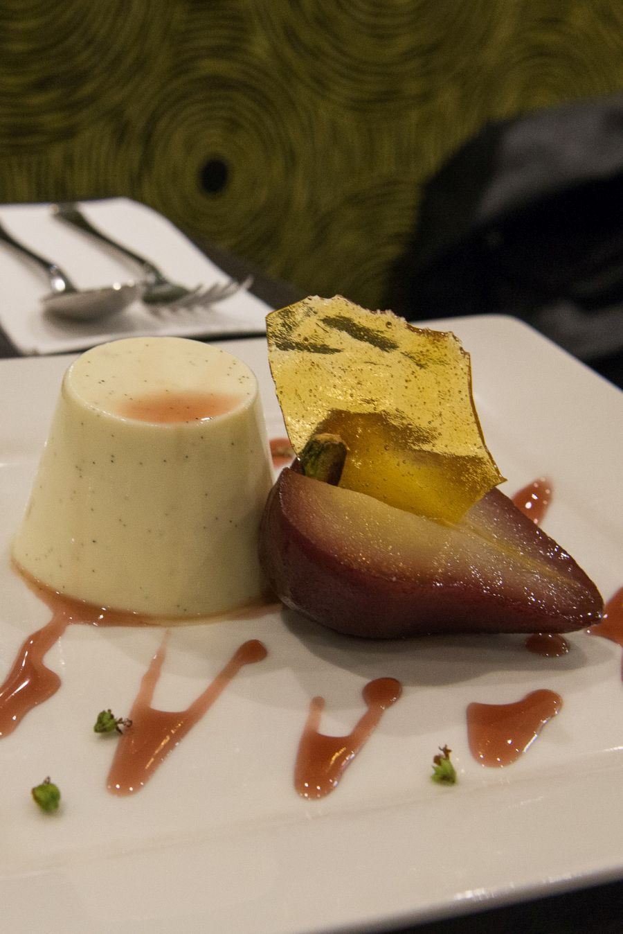 Vanilla bean and yoghurt pannacotta, pistachio praline, poached pear and rosewater syrup (AU$14.50)