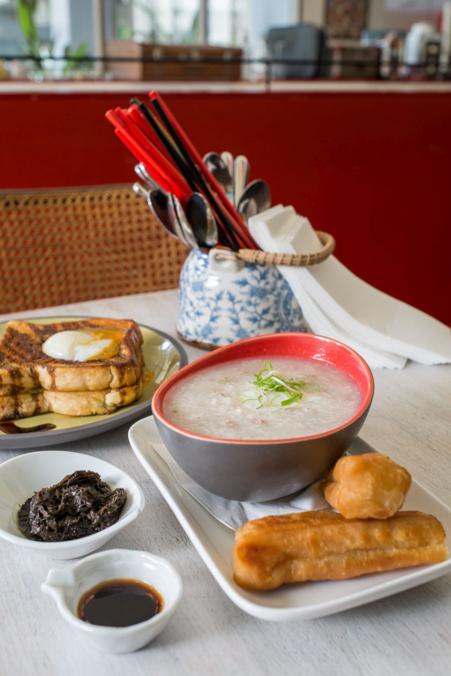 Pork mince and spring onion congee, 62C egg, Chinese doughnut (AU$9) - with must-have mustard pickle on the side