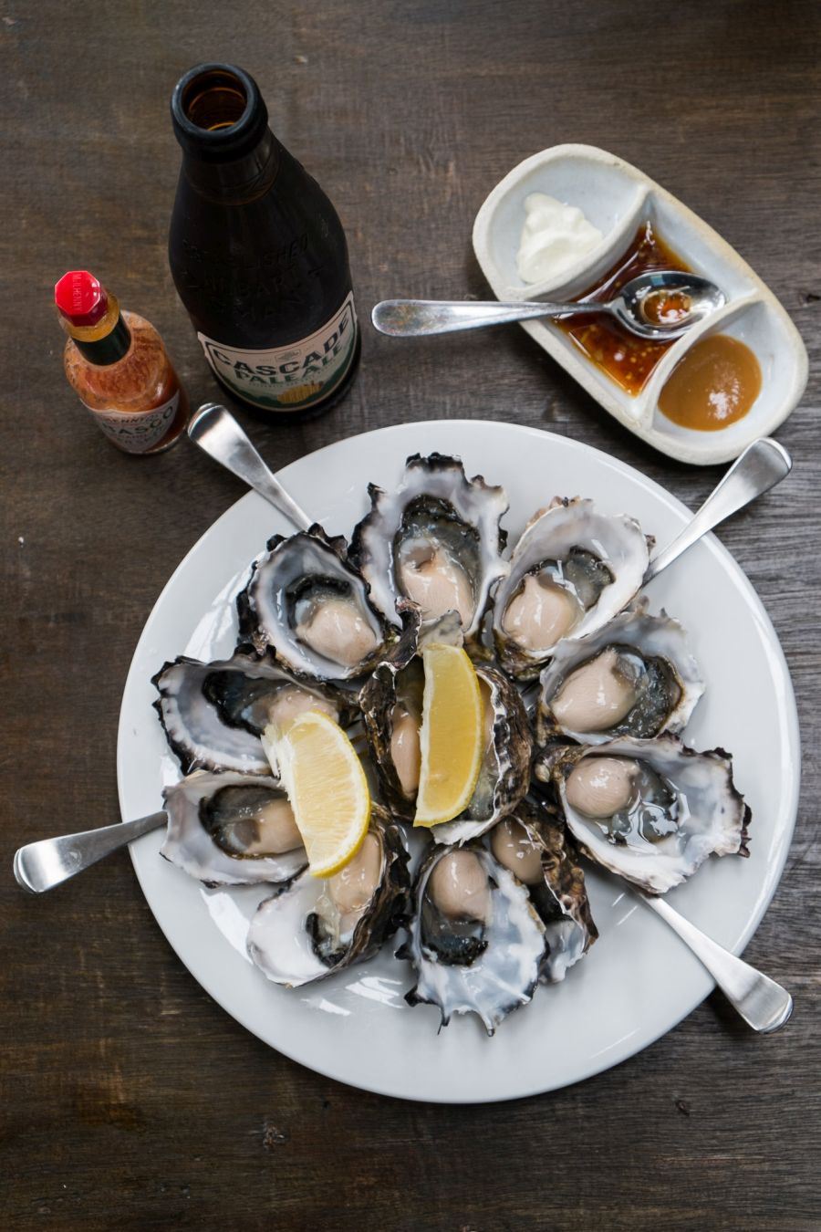 A dozen Bruny Island oysters with the three dressings of the day: miso, wasabi cream, Asian fusion: soy, rice vinegar, chilli, spring onion, sunflower oil and more