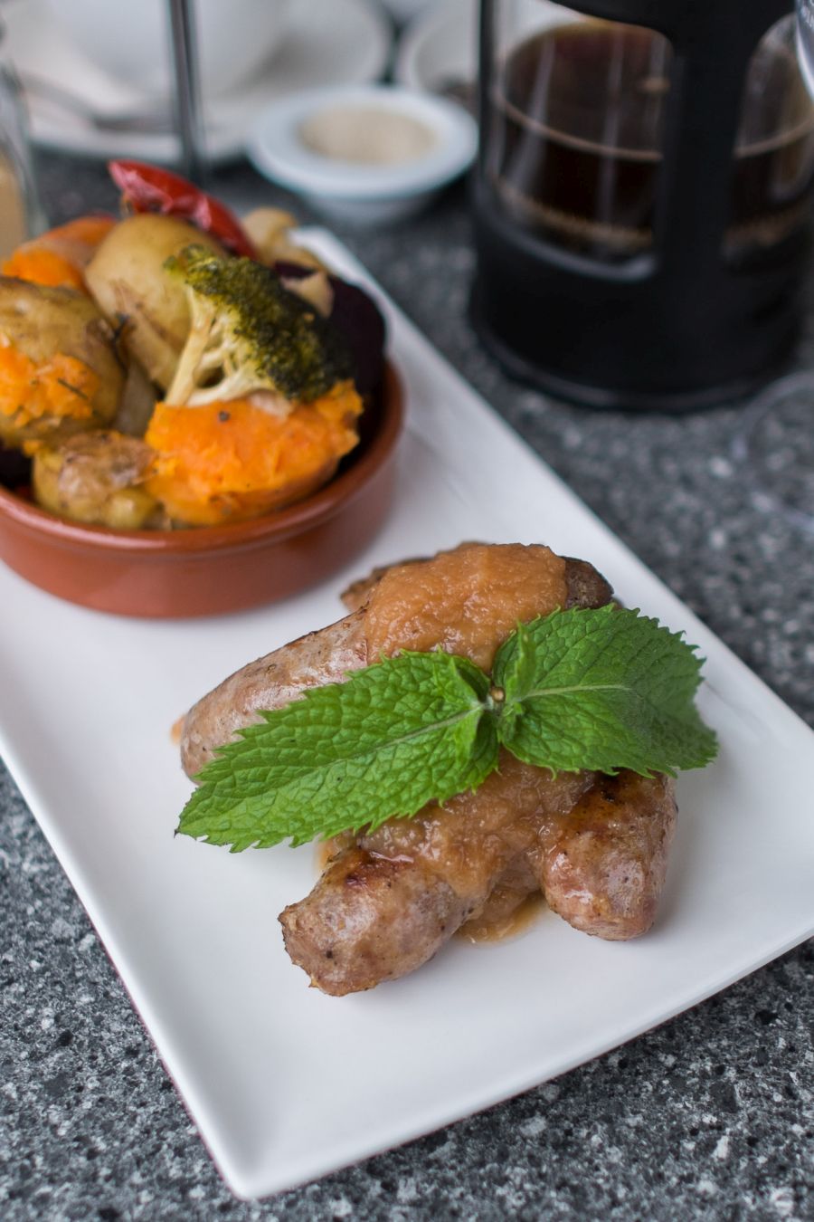 Bruny Toulouse pork sausages (AU$27), served with Pagan Cider infused Apple Isle sauce and vegetables