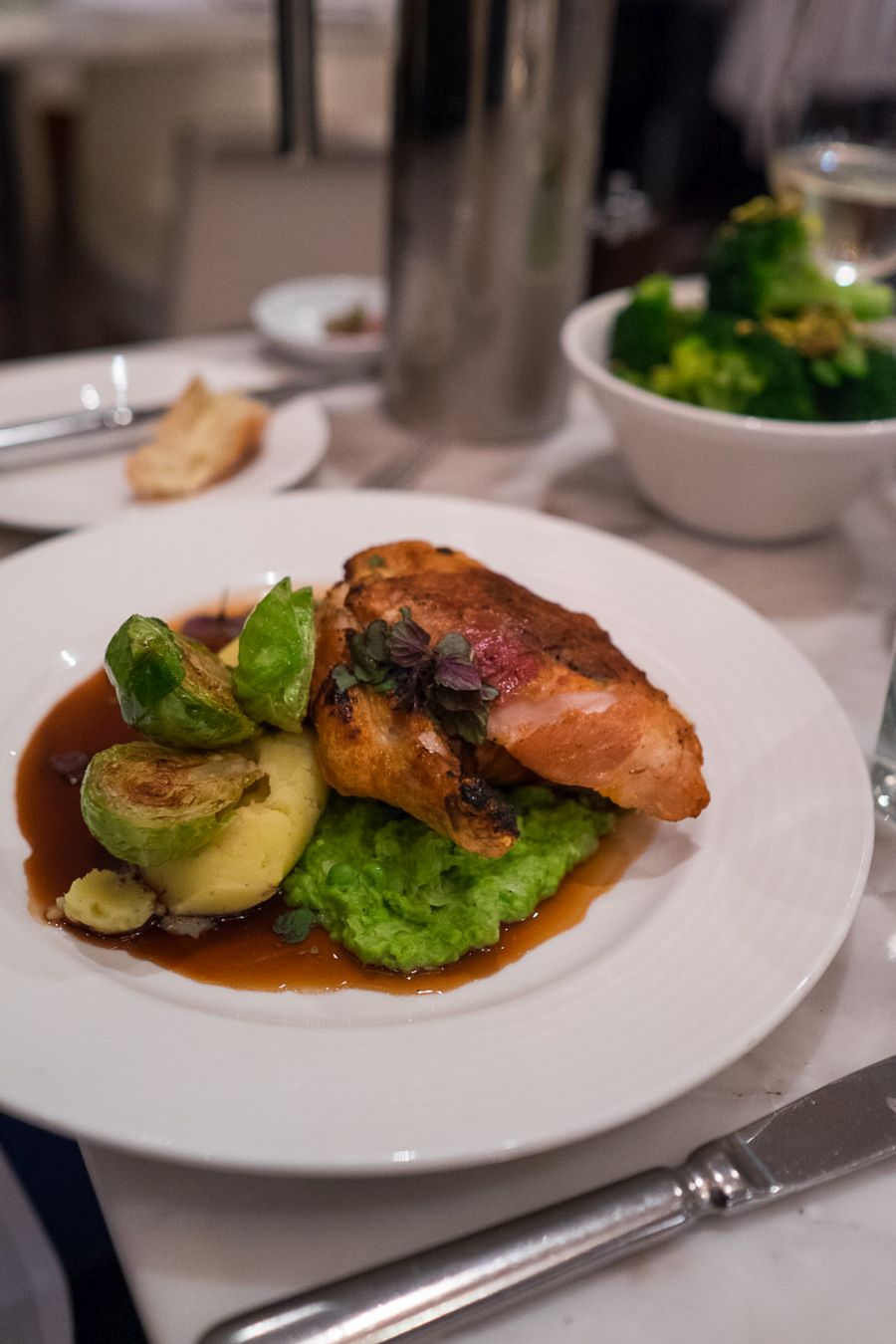 Sage and prosciutto wrapped chicken breast, crushed pea, garlic mash, Brussels sprouts(AU$39.50)