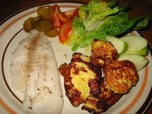 Steamed snapper, potato cakes, salad and fruit