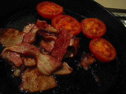 Frying bacon and tomato