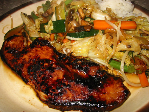 marinated pork steak with stir-fried vegetables and rice