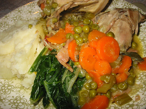 Braised chicken with vegetables, mashed potatoes and homegrown spinach