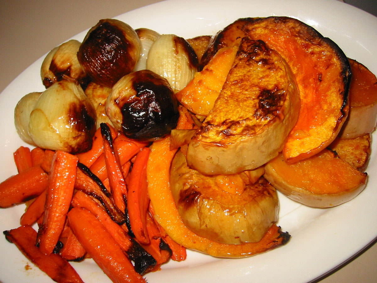 Roast pumpkin, onions and carrots on serving dish
