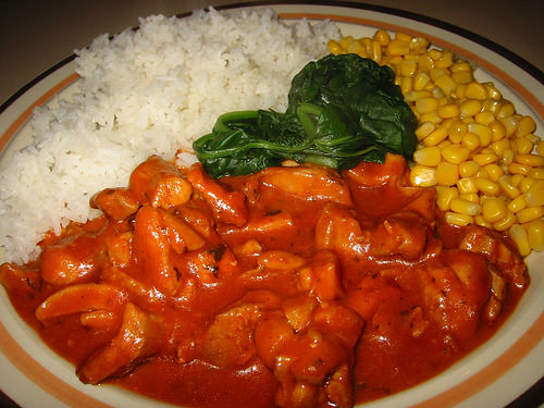 Butter chicken, spinach, corn kernels and rice