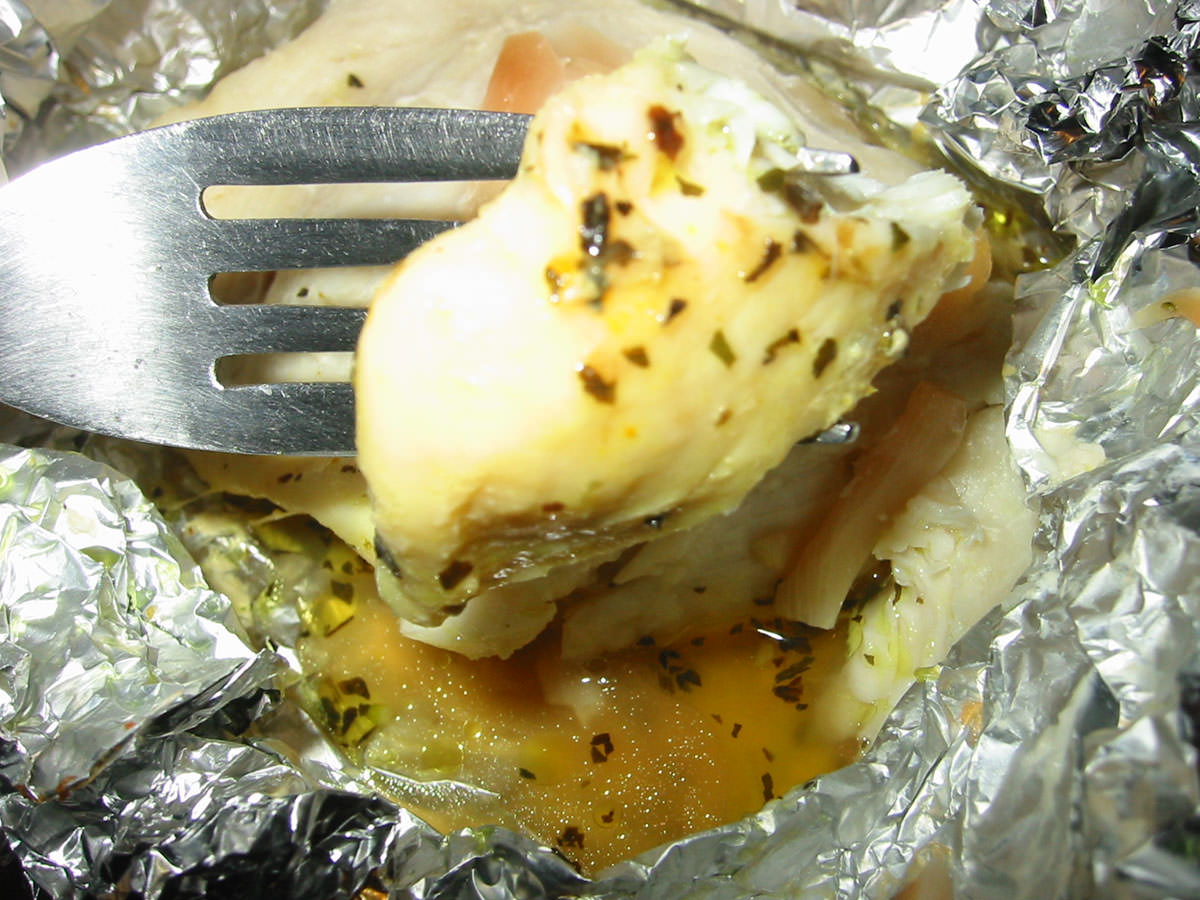 Baked fish with garlic, herbs and butter