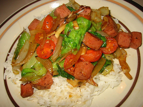 Stir-fried lettuce, cherry tomatoes and cubes of SPAM with rice