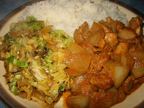 Stir-fried savoy cabbage, satay chicken and rice