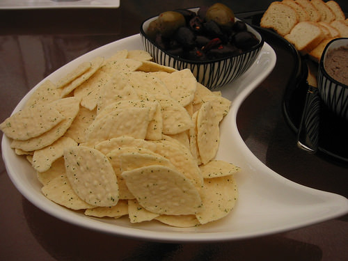 Marinated olives and sour cream and chive flavoured rice crackers