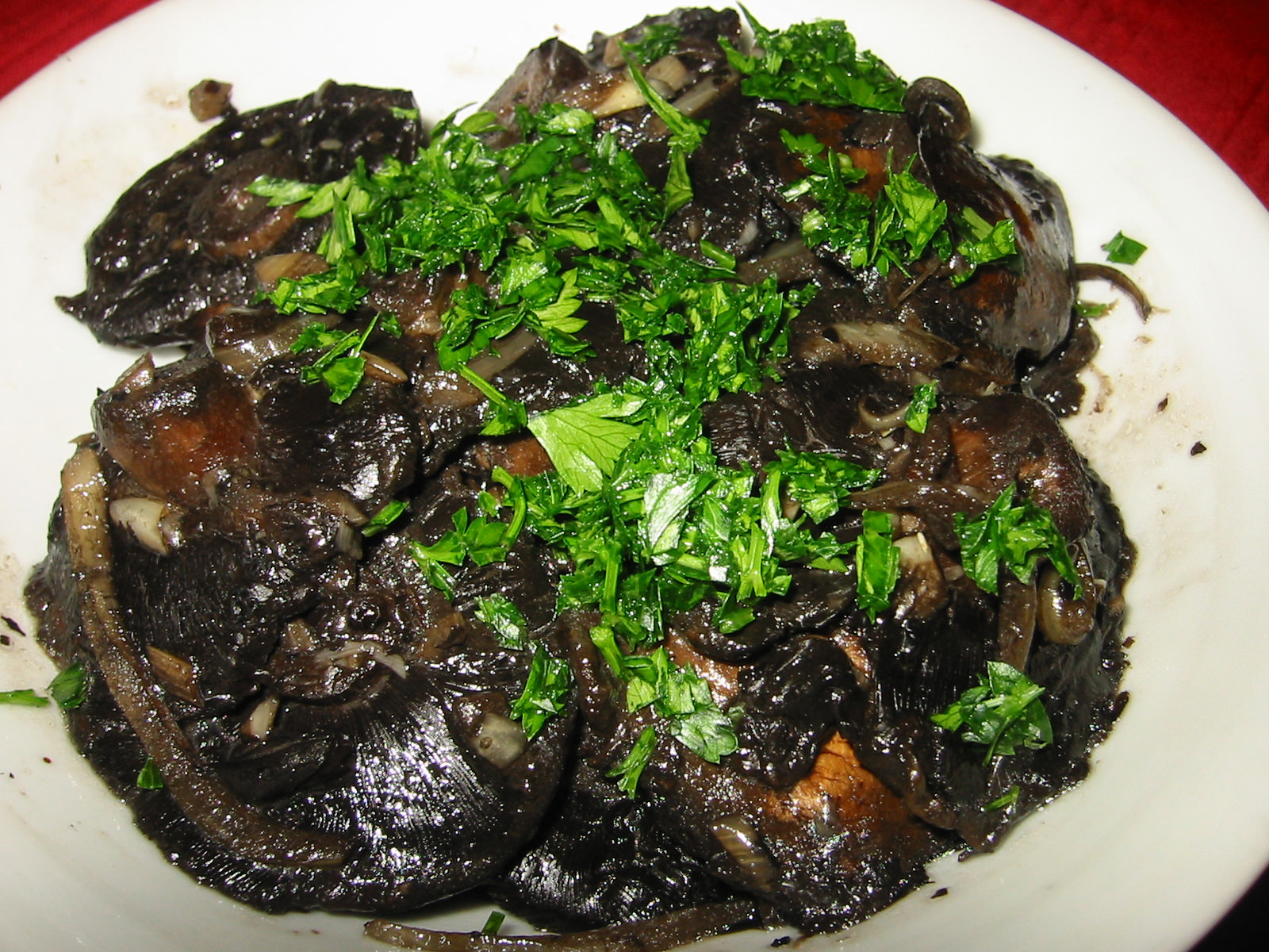 Grilled garlic and onion mushrooms topped with fresh parsley